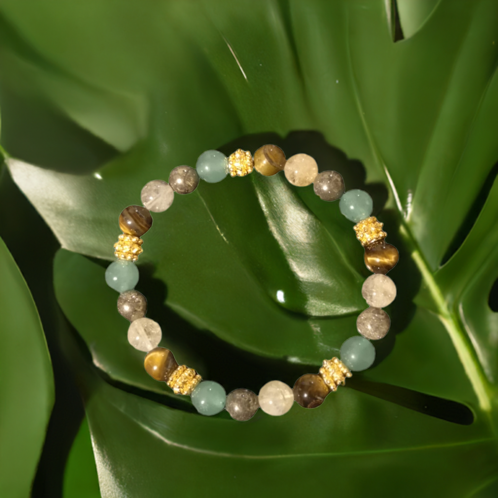 Abundance Alchemy Bracelet on a green leaf